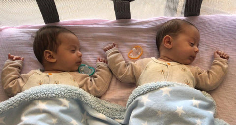 Nicole's twin babies sleeping with their nanobebe pacifiers