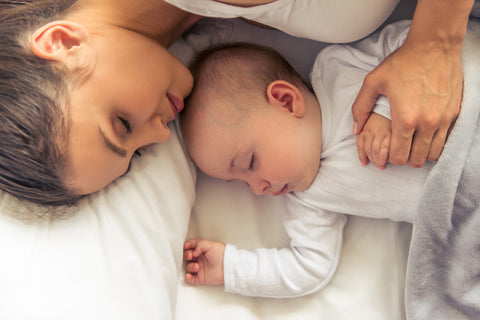 Mom sleeping with baby