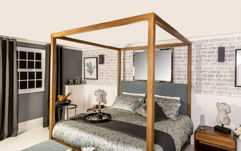 four poster wooden bed in  modern bedroom