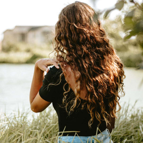 What makes hair curl naturally?