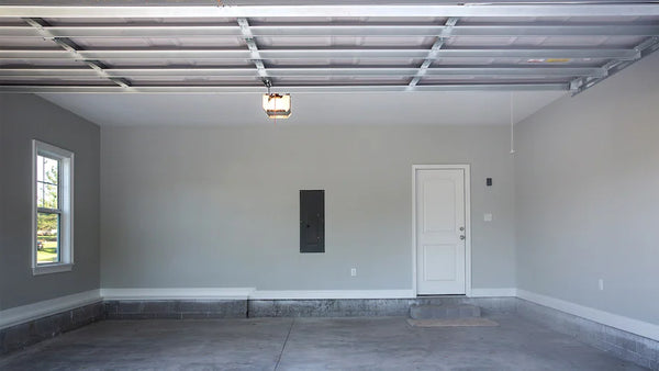 House to garage door inside a white garage