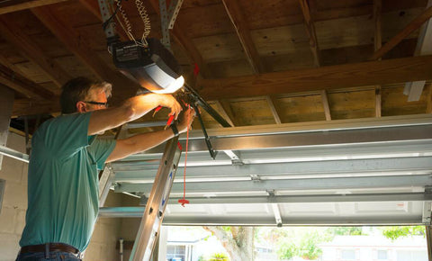 Man attempting to fix a garage door