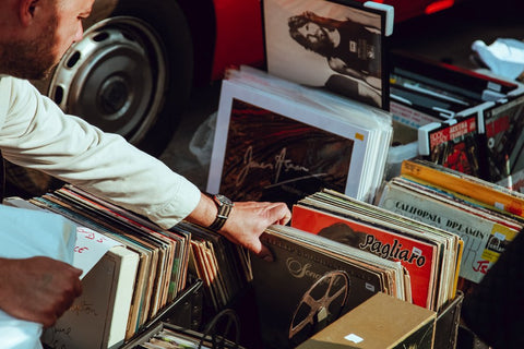 A man looking at a record collection