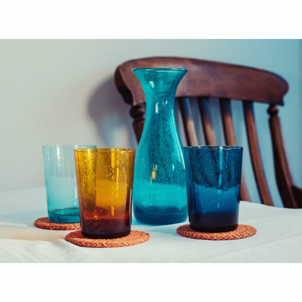 https://cdn.shopify.com/s/files/1/0269/2294/2529/products/BCS_Glass_50clt_Carafe_honey_bird_blue_with_3_mixed_colour_tumblers_and_Tangerine_Jute_Coaster_1_copy_1296x_a4a28aba-e4da-442e-b08a-071a6c5ca5de_1800x1800.jpg?v=1646518710