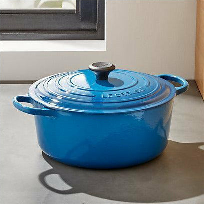 https://cdn.shopify.com/s/files/1/0269/2294/2529/products/le-creuset-signature-9-qt.-round-marseille-blue-french-oven-with-lid_1800x1800.jpg?v=1662994154