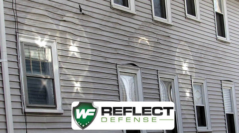 Low E windows reflecting on siding causing damage by neighbors windows