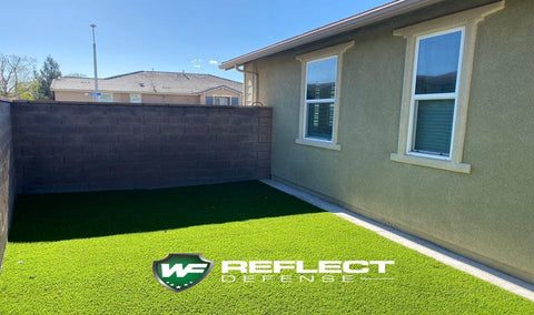 Black Film by Reflect Defense Window Film Installed on Home protecting turf