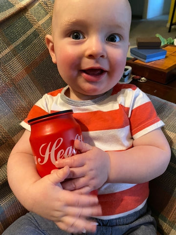 baby loves their pretend soda can toy