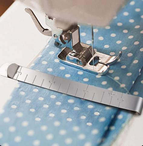 Sewing Clip with 3 Inch Ruler on fabric being sewed by machine