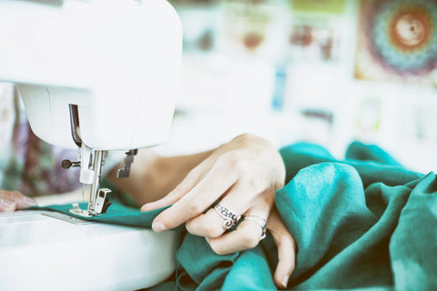 Female Hand Sewing Her Own Clothes on a Sewing Machine