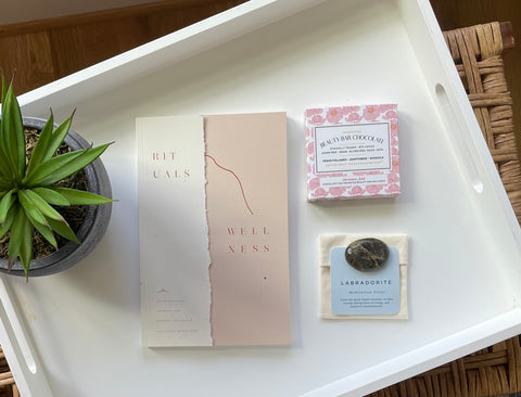 picture of wellness journal, beauty bar chocolate and meditation stone