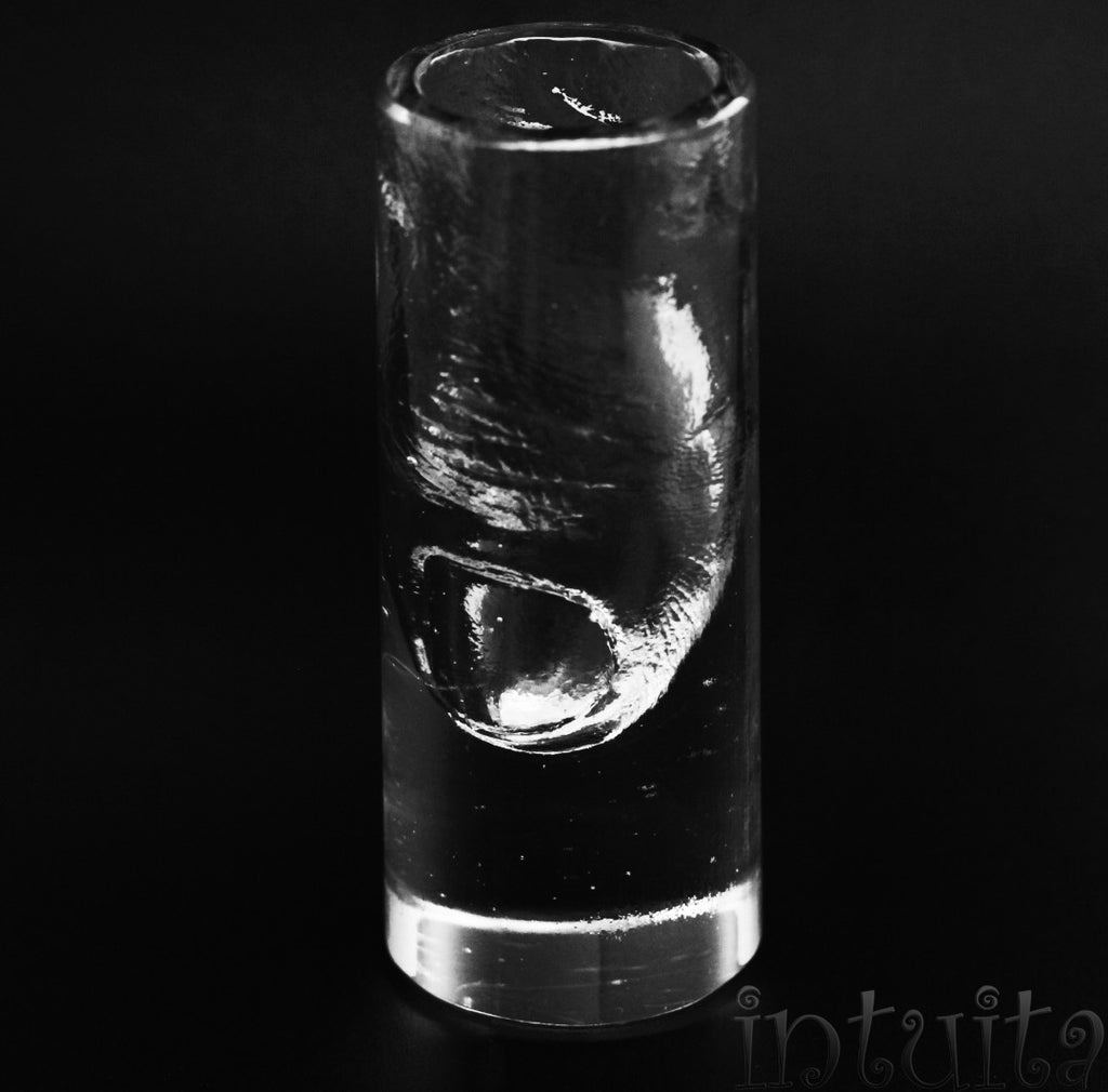 shot glass with thumb finger inside for Christmas in Intuita