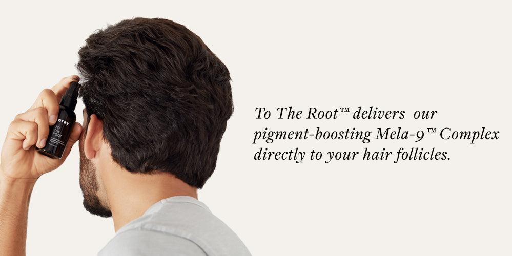 man applying hair serum to scalp