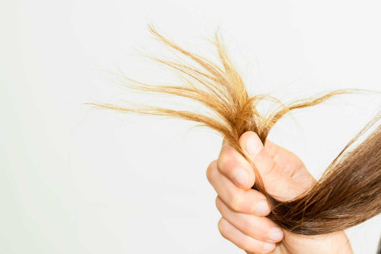 Woman looks at the brassy tones in her faded hair color