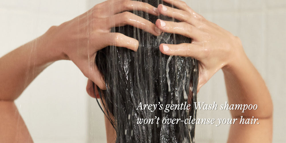 woman washing hair in shower