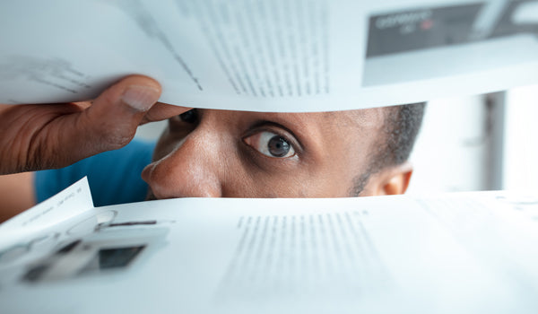 African-american man looking for something in unusual