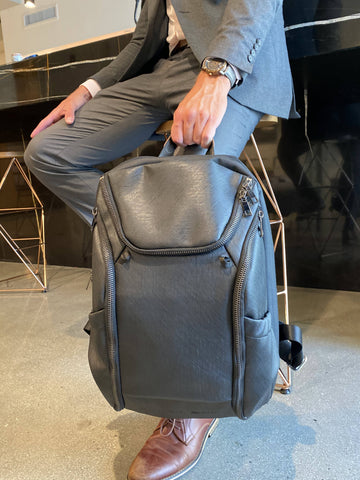 Dylan Sky DTLA backpack looks good with a wetsuit or a business suit. Features customizable shelving and waterproof dry pouch