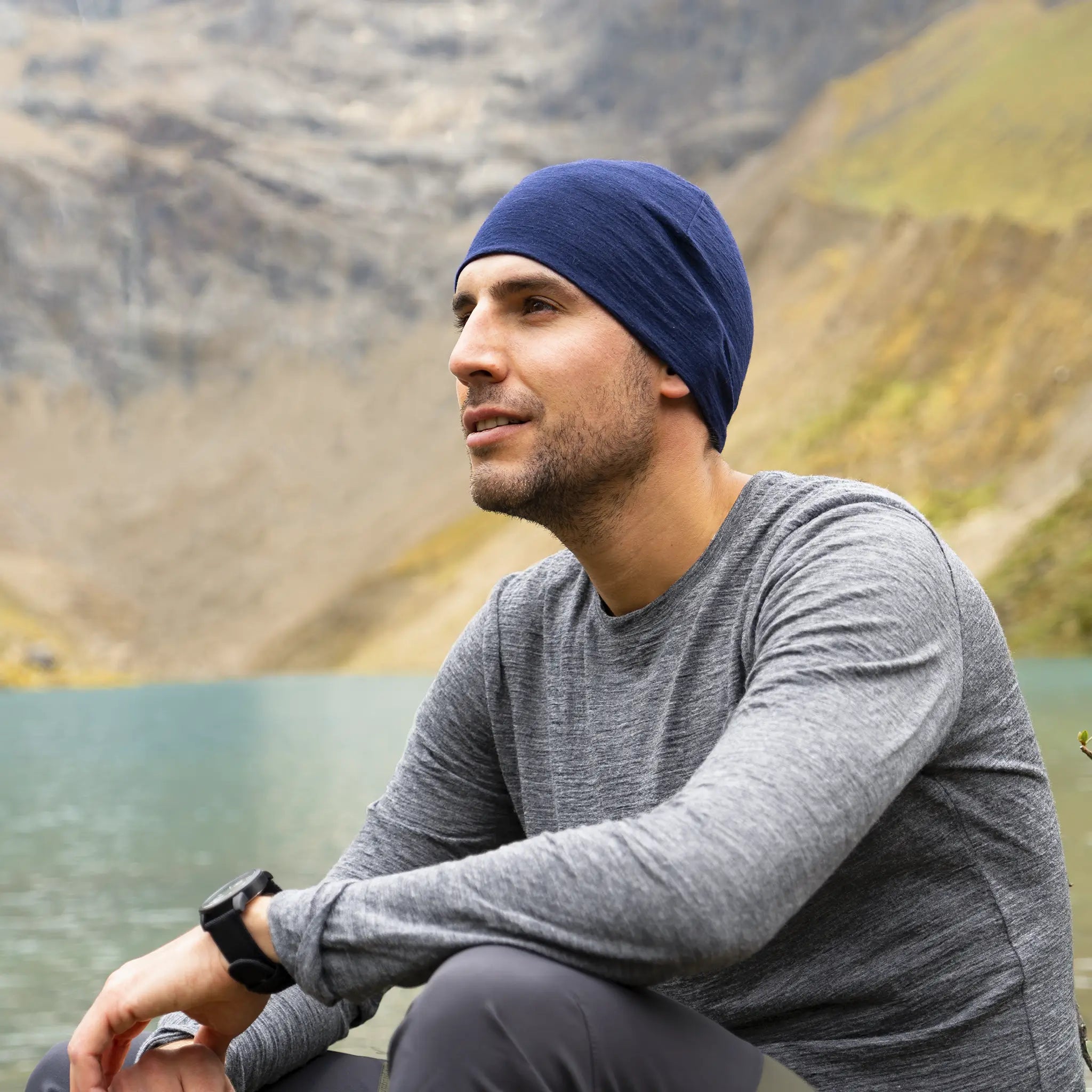 Man wearing alpaca wool long sleeve t-shirt on a hike in the mountains