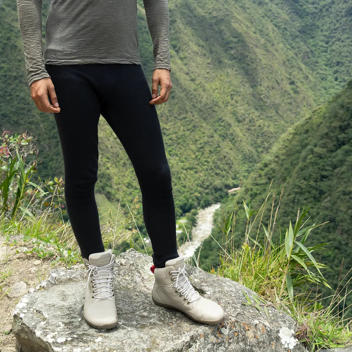 Man wearing alpaca wool leggings on a hike in the mountains