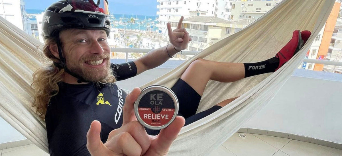 Tyler Locke holding a Keola Pain Relief CBD Balm