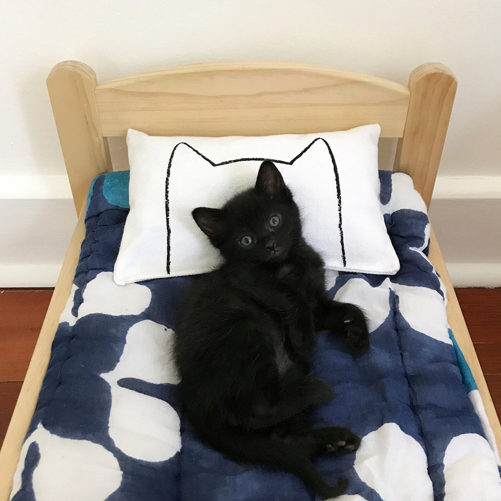 Veggiedazy cat instagram photo of Xenotees catnap pillow on an IKEA DUKTIG bed