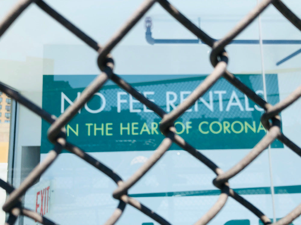 Photo by Matt of a sign, 'No Fee Rentals In The Heart Of Corona'