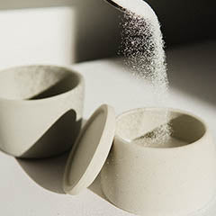 sugar pouring into a cup