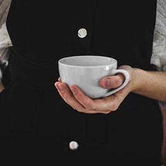 holding a cup of tea
