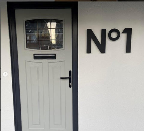 Grey front door with Giant Floating No 1 Sign in Matt Black Acrylic