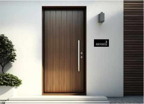 Modern front door with small rectangular laser cut house sign