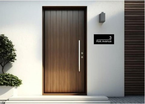 Modern front door with medium rectangular laser cut house sign