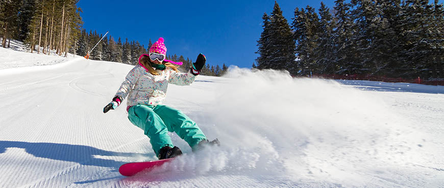 Girl shredding on snowboard