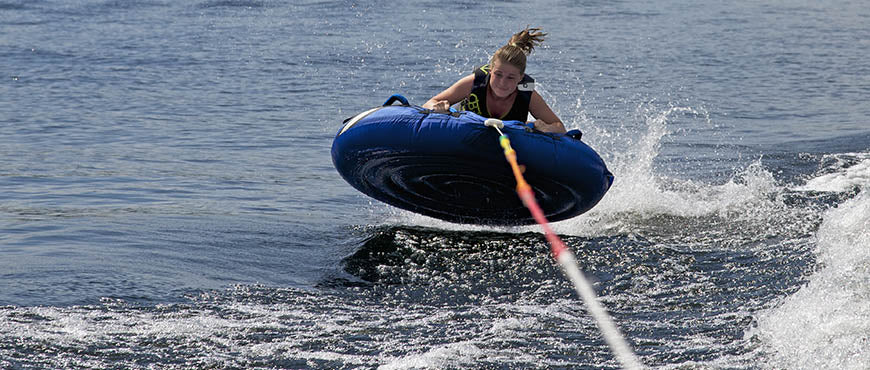 Tubing behind boat