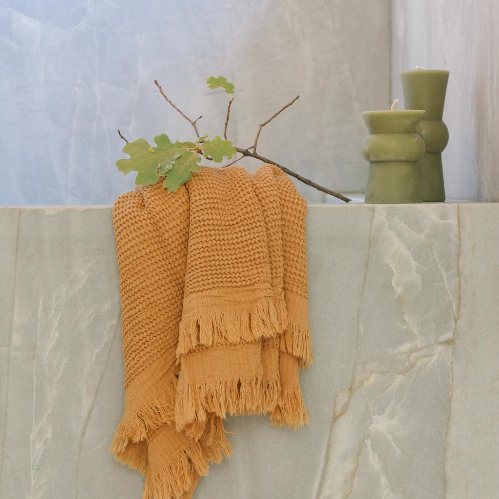 https://cdn.shopify.com/s/files/1/0269/9336/0981/products/tan-hand-towel-830532_1024x1024.jpg?v=1701974808