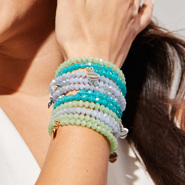 blue and green beaded bracelets stack