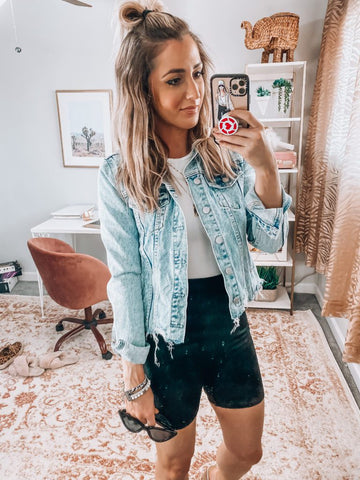 graphic tee with biker shorts and denim jacket