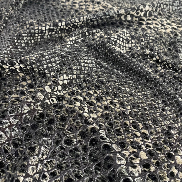 Gray fluffy velvet fabric with an interesting and intriguing pattern in the  form of a snake skin like fish scales with a shine and a pleasant tint  Stock Photo - Alamy