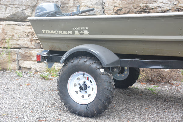 Jon boat trailer lifted with trailer blocks