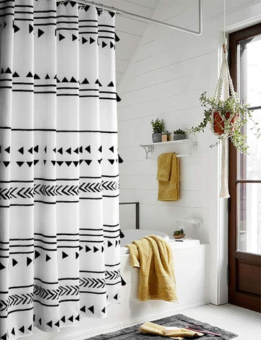 Black and white geometric pattern shower curtain, adding modern elegance to bathroom decor.