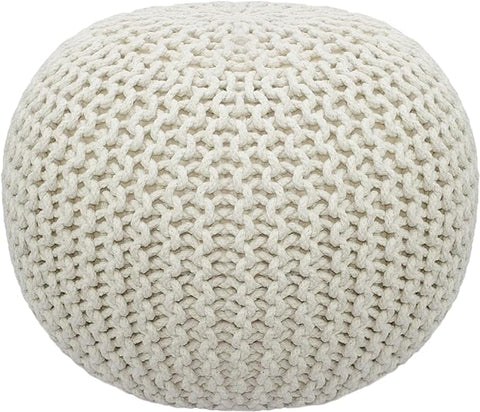 Hand-knitted ivory pouf with cable style design, perfect for bohemian decor.