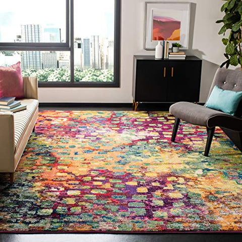 Pink and multi-colored area rug with abstract watercolor design, ideal for bohemian decor.