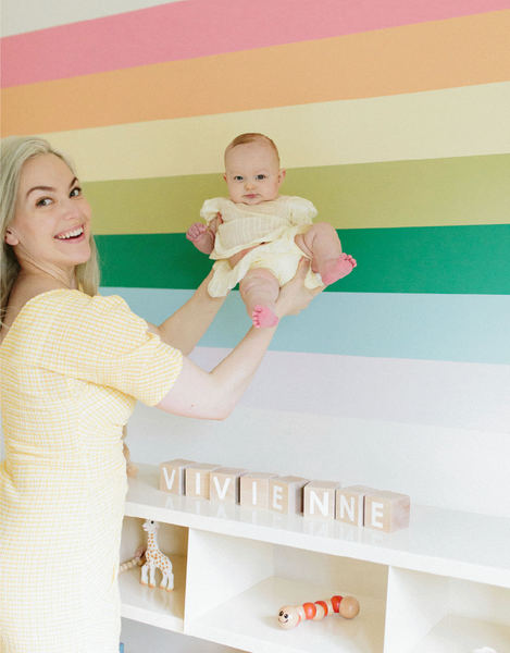 Alexandra Ulmer. AU Baby Journal. DIY Rainbow wall mural tutorial. How to paint a rainbow wall mural. Gender neutral nursery design ideas. Gender neutral nursery decor ideas.