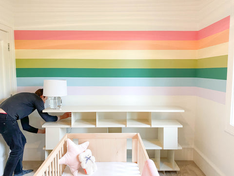 AU Baby Journal. DIY rainbow wall nursery decor. Step by step guide to painting a rainbow mural. Gender neutral nursery decor design ideas.