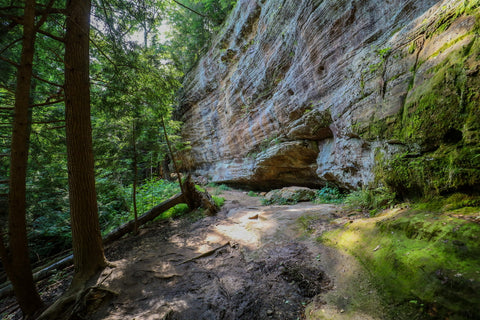 Caves and rock shelters along hiking trail to whispering cave in Hocking Hills State Park Ohio 