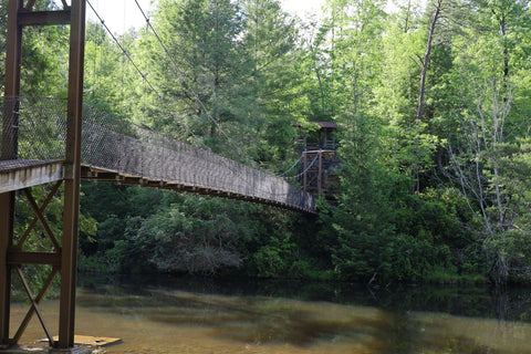 suspension bridge over arch lake in pickett ccc state park