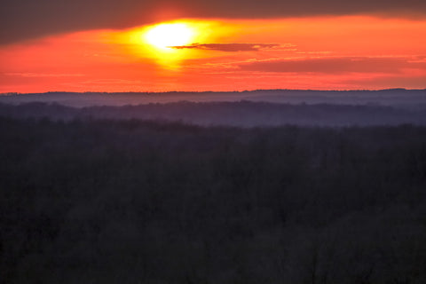 watching the sun set over hills surrounding o'bannon woods state park