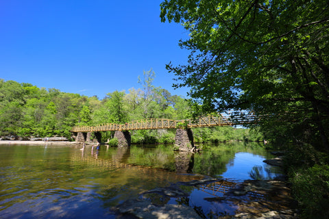 Historic bridge crossing town creek and high falls waterfall in Alabama 