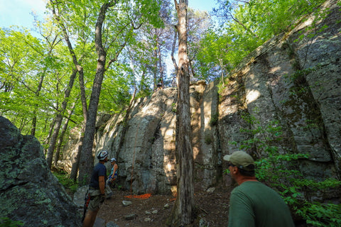 Hikers rappelling from upper bluffs of river trail in DeSoto Falls Picnic Area in northeast Alabama 