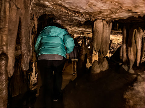 hiking through underground passages along crystal palace tour in marengo cave