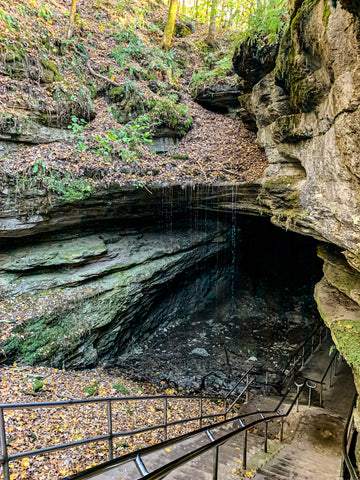 historic entrance with waterfall into mammoth cave national park kentucky